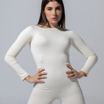 Model wearing The Seamless Long Sleeve Onesie in cream with short legs, front view