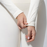 Close-up of the ribbed sleeve and cuff on The Seamless Long Sleeve Top in cream