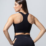 Racerback detail of The Seamless Bra Top in black, back view