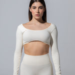 Model wearing The Seamless Long Sleeve Top in cream, front view